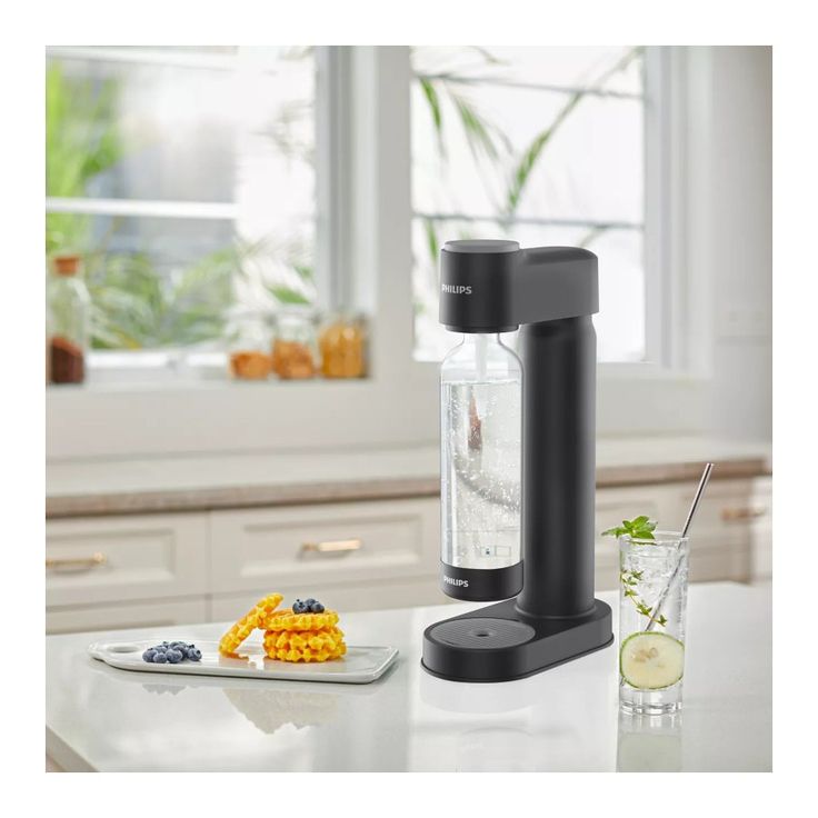 A máquina de água com gás e refrigerante
